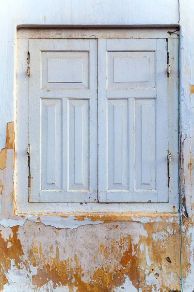 White shutters old frame window on cement wall — Stock Photo, Image