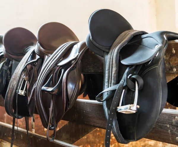 Rider Leather Saddles on fence livestock — Stock Photo, Image