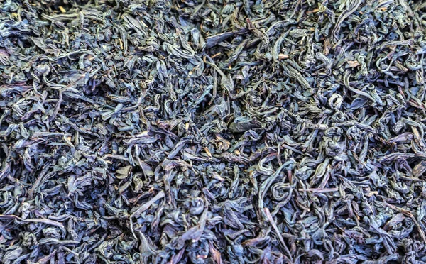 Schwarzer getrockneter Tee Blätter Hintergrund — Stockfoto