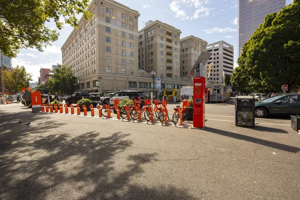 Bike sharing program Bike Town in downtown with orange bicycles