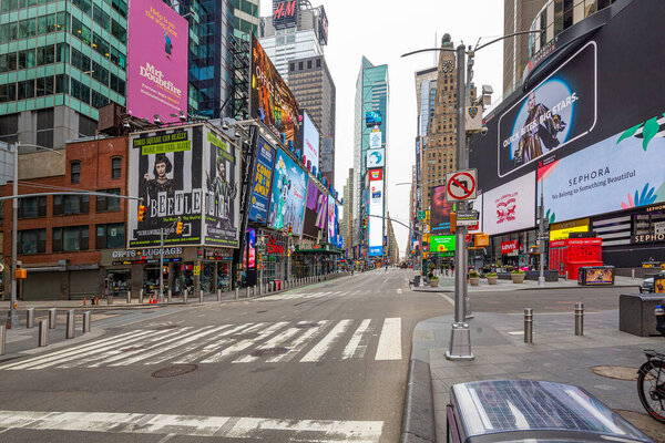 Manhattan. New York / USA - April 17, 2020: Empty streets of New York at Times Square 42nd street during pandemic virus Covid-19