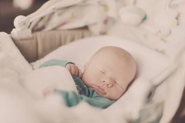 Newborn sleeping in crib — Stock Photo, Image