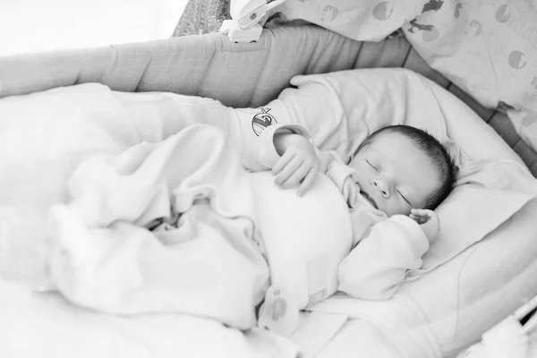 Newborn in the crib — Stock Photo, Image