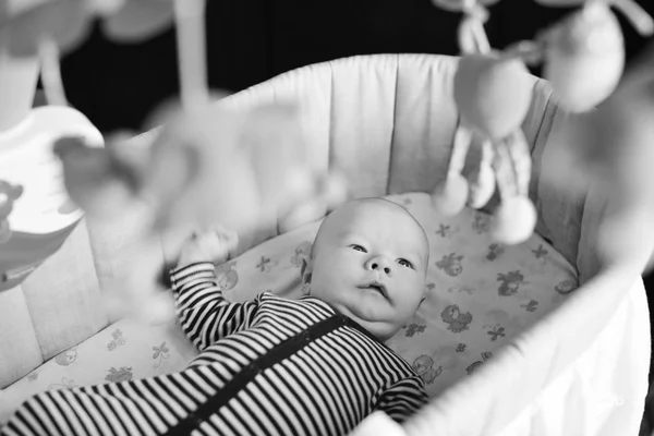 Baby in crib — Stock Photo, Image