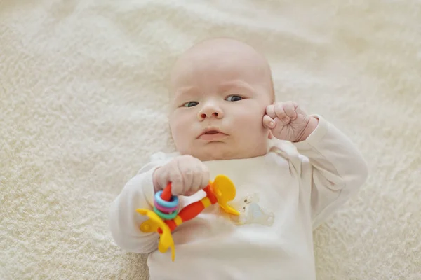 Newborn baby with toy — Stock Photo, Image