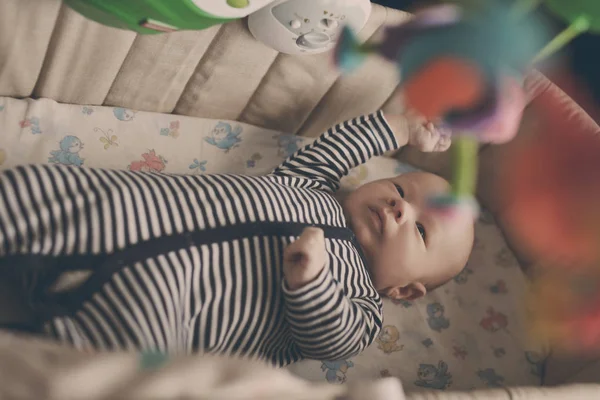 Baby in crib — Stock Photo, Image