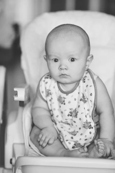 Funny baby trying to seat — Stock Photo, Image