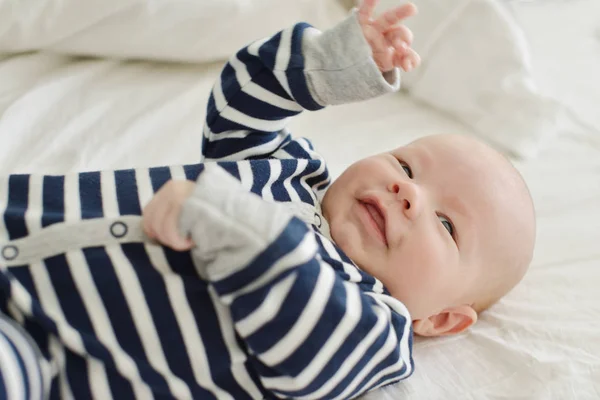 Happy baby on the bed — Stock Photo, Image