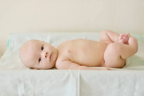 Baby on diaper board — Stock Photo, Image