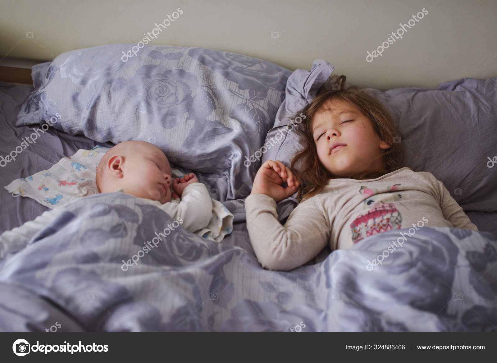 Young Sister On Parents Bed