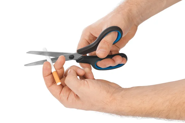 Hand with scissors and cigarette — Stock Photo, Image