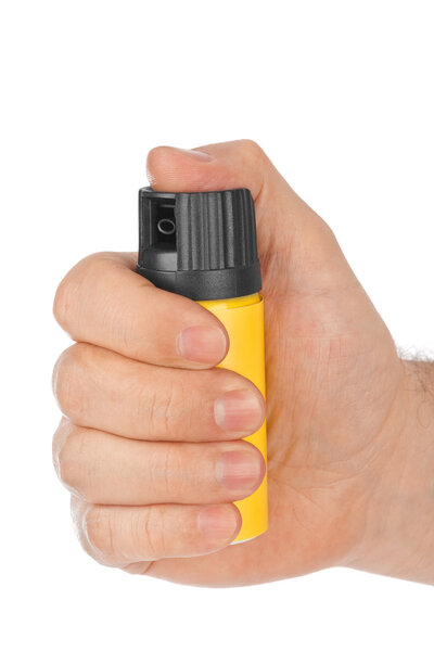 Hand with bottle of pepper spray