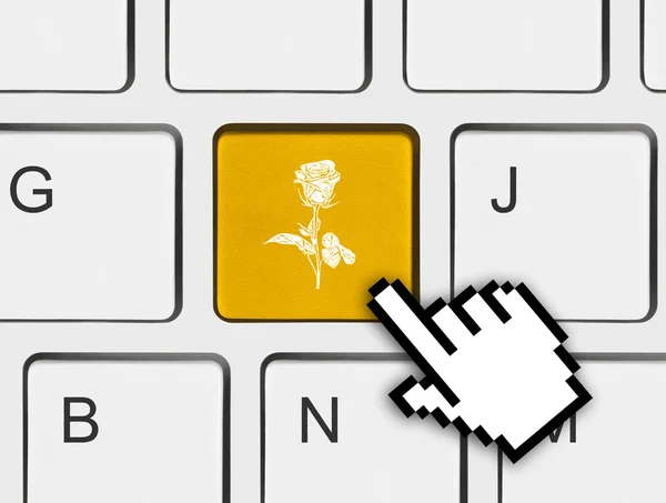 Teclado de computador com chave de flor — Fotografia de Stock