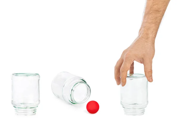 Hand and shell game with glass cans — Stock Photo, Image