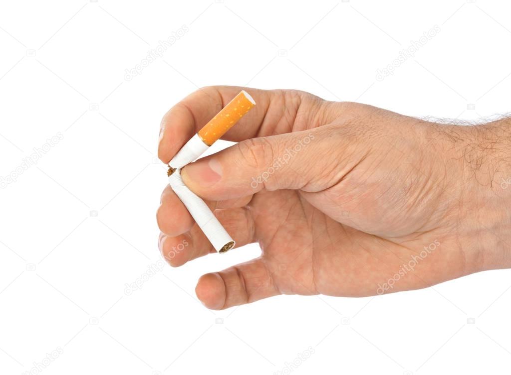 Broken cigarette in hand