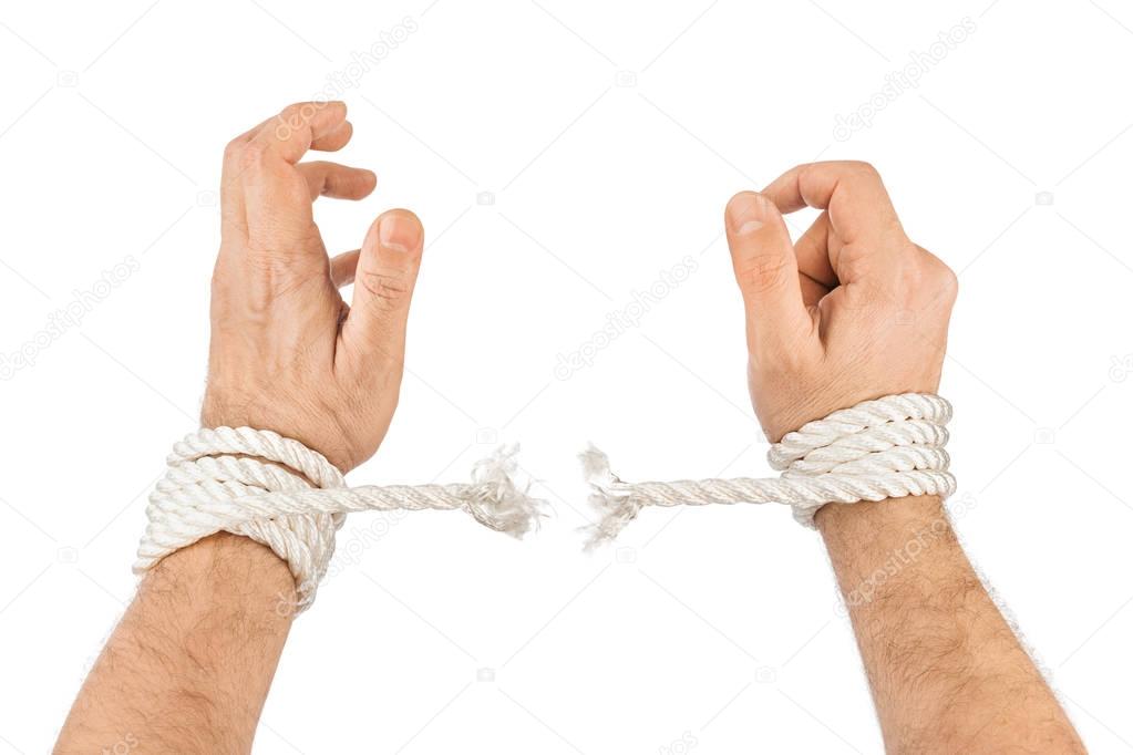 Hands and breaking rope