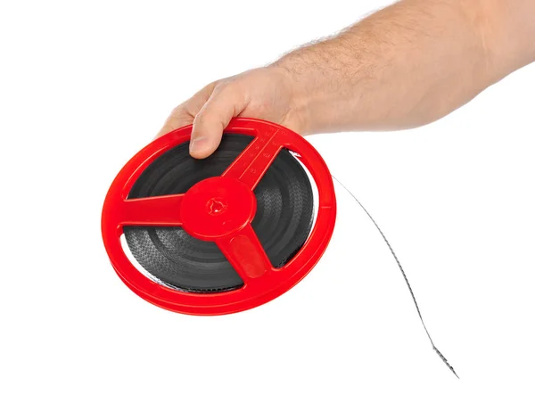 Cinema film reel in hand — Stock Photo, Image