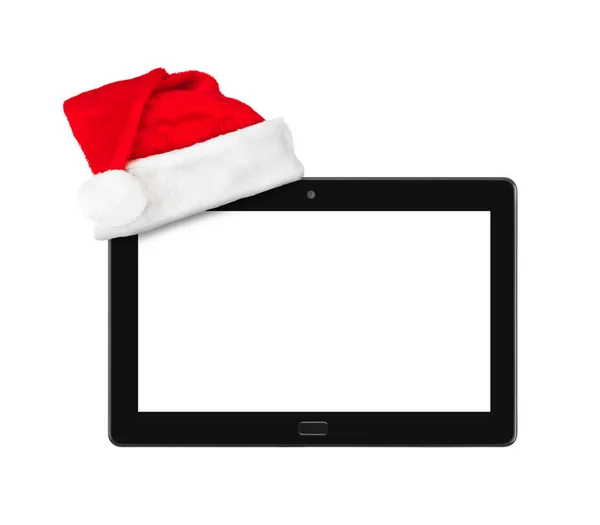 Touchpad pc en Santa Claus rode kerstmuts — Stockfoto