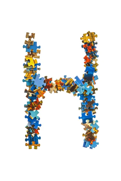 Carta H feita de peças de quebra-cabeça — Fotografia de Stock