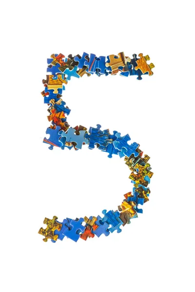 Número 5 feito de peças de quebra-cabeça — Fotografia de Stock