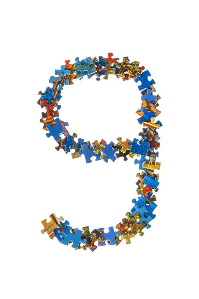 Number 9 made of puzzle pieces — Stock Photo, Image