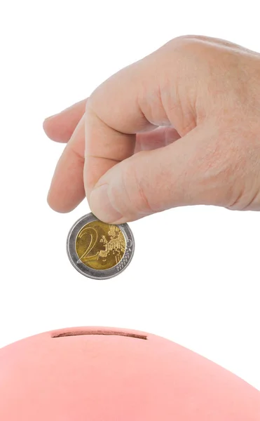 Hucha y mano con moneda — Foto de Stock