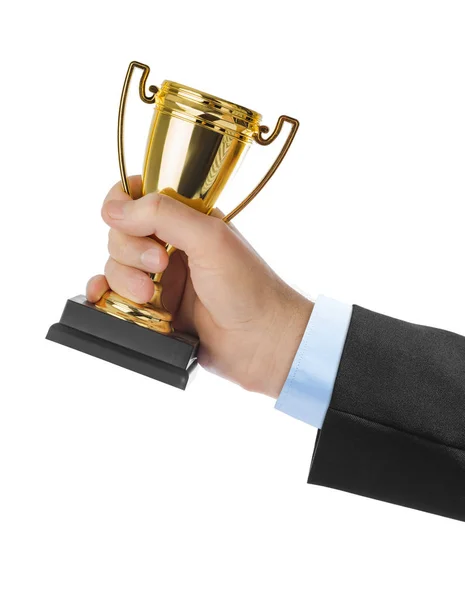 Golden trophy cup in hand — Stock Photo, Image