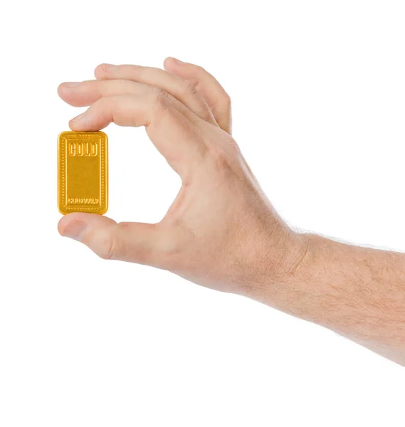 Рука з золотим баром — стокове фото
