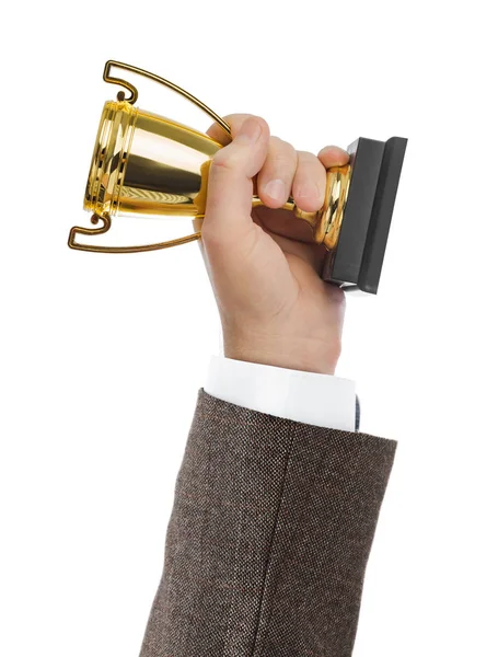 Golden trophy cup in hand — Stock Photo, Image