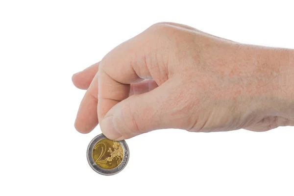 Рука с монетой евро — стоковое фото