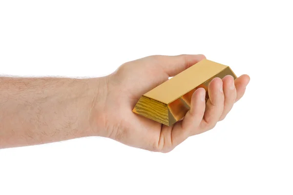 Mão com barra de ouro — Fotografia de Stock
