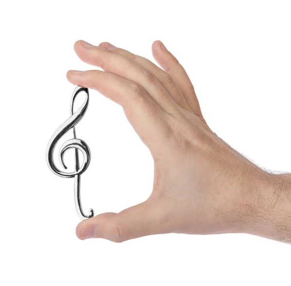 Hand holding a treble clef — Stock Photo, Image