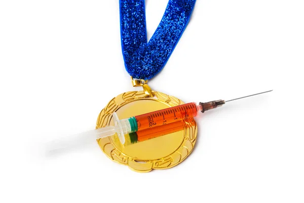 金メダルと注射器 — ストック写真
