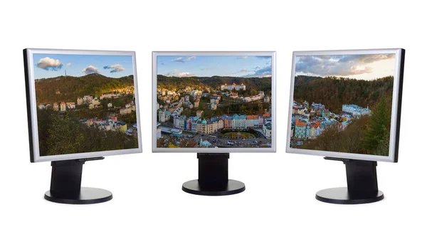 Karlovy Vary in Czech Republic (my photo) on computer monitors — Stock Photo, Image