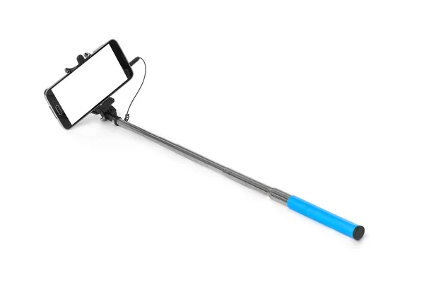 Smartphone con selfie stick —  Fotos de Stock