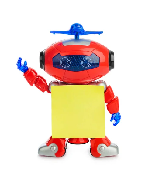 Spielzeugroboter mit leerem Papier — Stockfoto