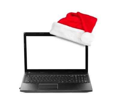 Dizüstü bilgisayar ve Santa Claus kırmızı Noel şapka