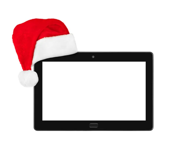 Touchpad pc en Santa Claus rode kerstmuts — Stockfoto