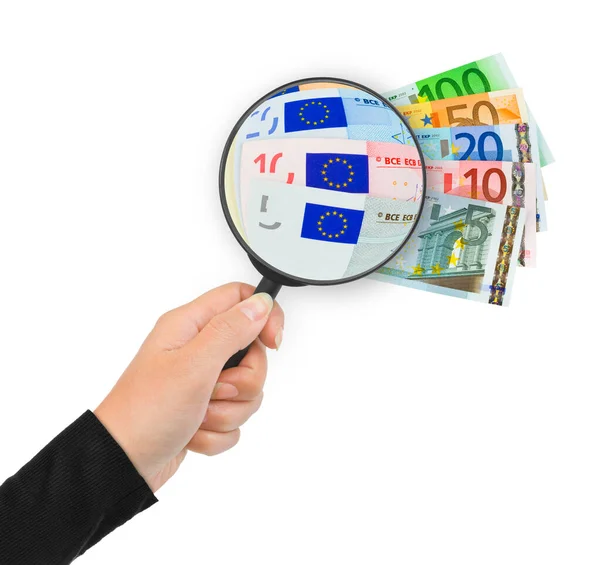 Hand with magnifying glass and money — Stock Photo, Image