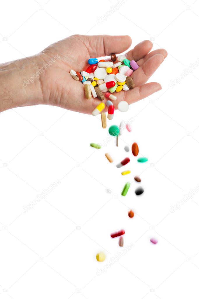 Hand and falling pills