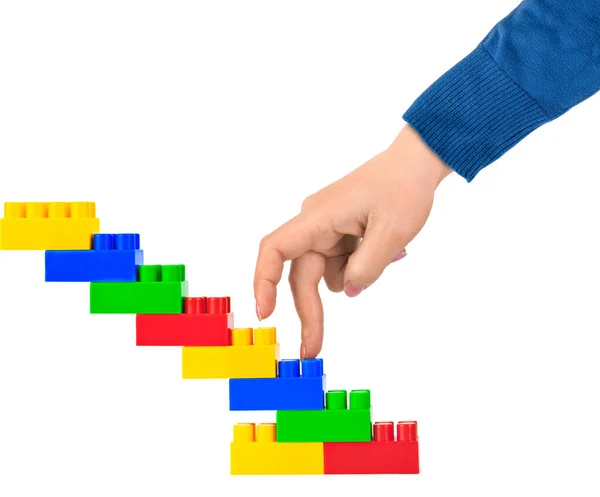 Hand and toy stairs — Stock Photo, Image