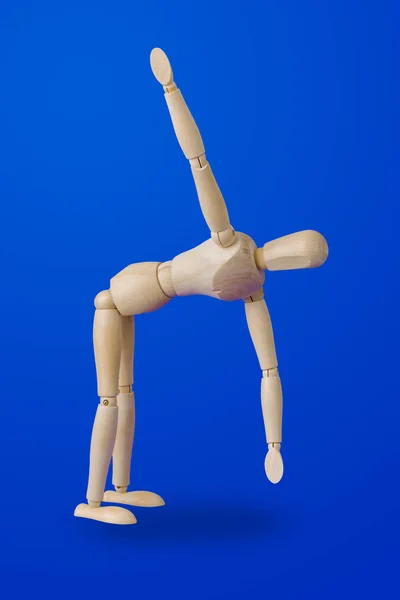 Sports wooden toy figure on blue — Stock Photo, Image