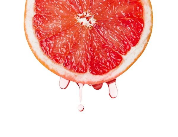 Reife Grapefruit und Tropfen Saft — Stockfoto