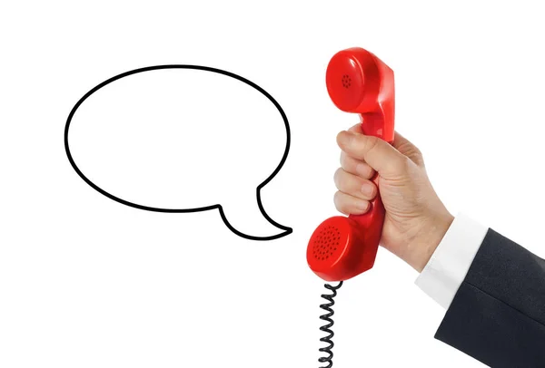 Telephone receiver in hand and speech bubble — Stock Photo, Image