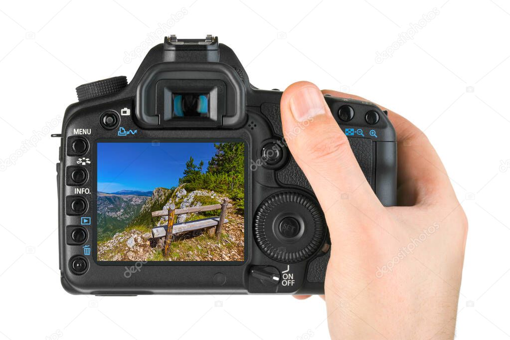 Hand with camera and River Tara canyon - Montenegro image (my photo) isolated on white background