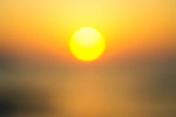 Oranje zee zonsondergang bokeh achtergrond wazig. — Stockfoto