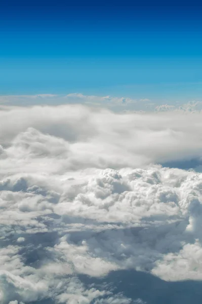 Cloudscape with blue sky above vertical image. — Stock Photo, Image