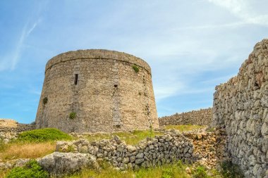 Torre den Penjat stone fort at Menorca, Spain clipart