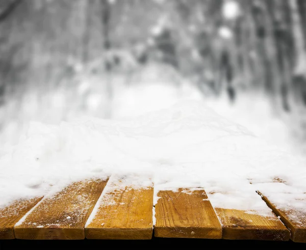 Wooden desk covered by snow