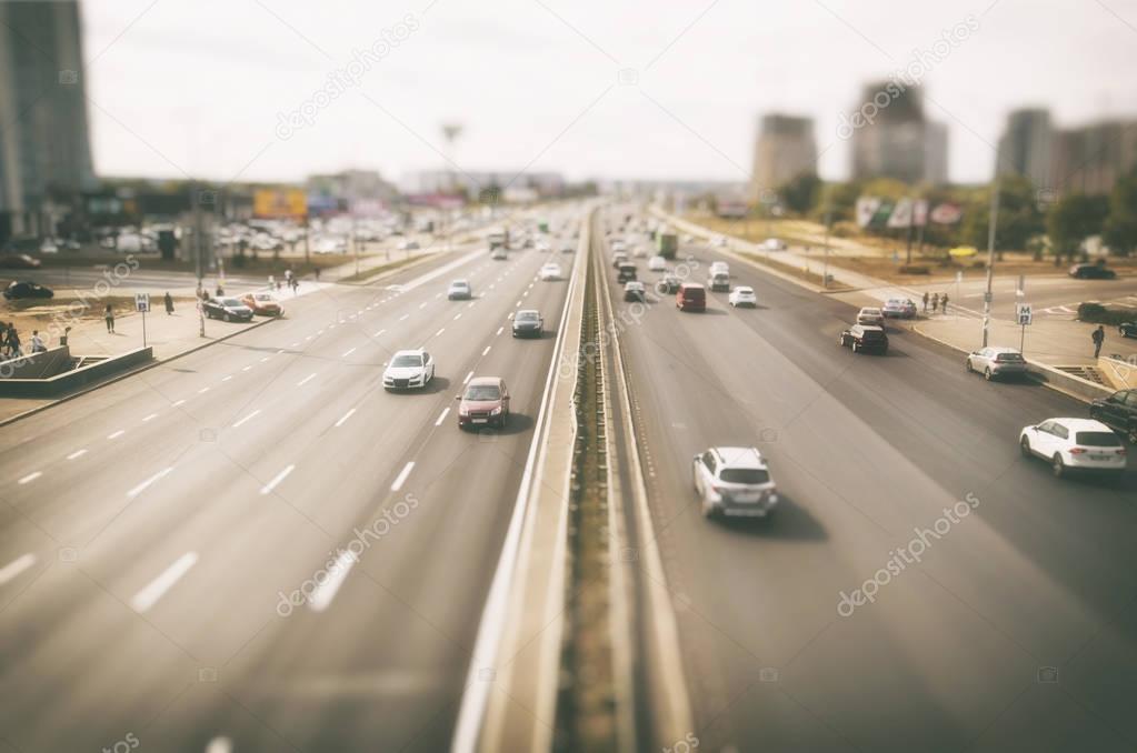 View on asphalt road with lots of cars